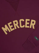 The mercer sweater met logo