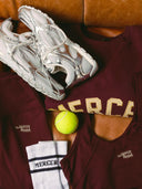 The mercer sweater met logo