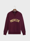 The mercer sweater met logo