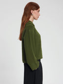 Donkergroene trui met knopen lana