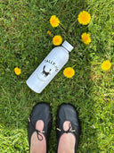 Witte waterfles met logo 60 jaar