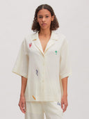 Off-white blouse met embroidery holly