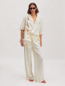 Off-white blouse met embroidery holly
