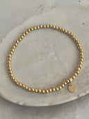 Armbandje met gouden balletjes small