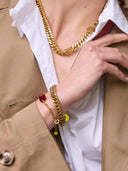 Schakelarmband met bordeauxrode steen